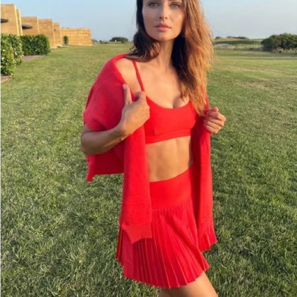 new alo grand slam pleated tennis skirt in red hot summer